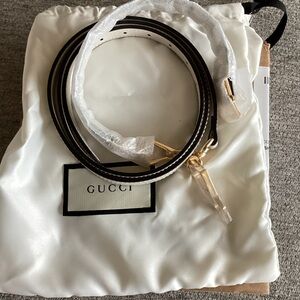 Gucci Black and White Leather Strap with Gold Accents